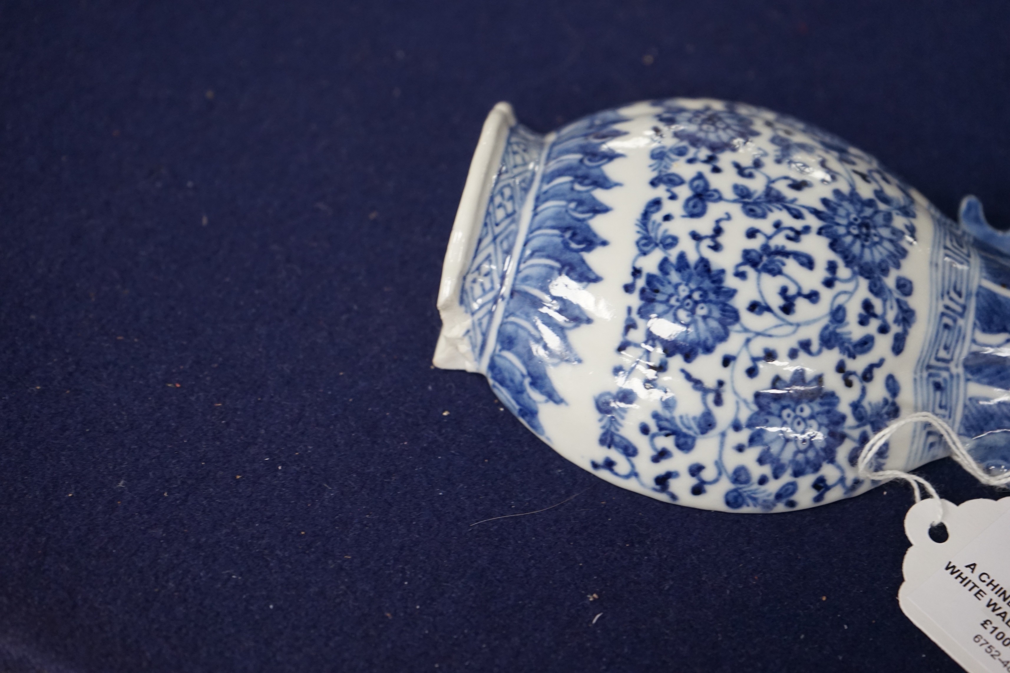 A Chinese blue and white wall vase shaped pocket, 19th century, 16.5cm tall